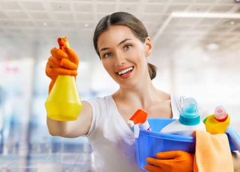 Professional carpet cleaner treating a stained carpet