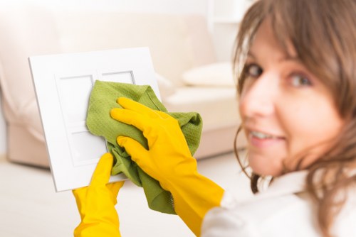 Professional cleaners working in an NW10 office kitchen and shared space